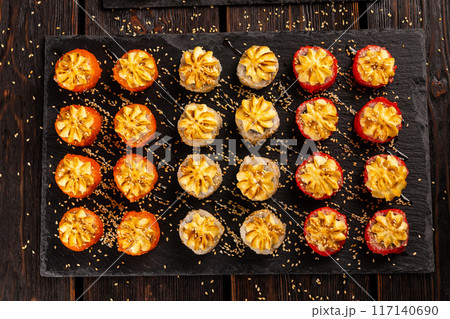 Rolls set with fish shrimp and caviar sushi with chopsticks - asian food and japanese cuisine concept top view 117140690