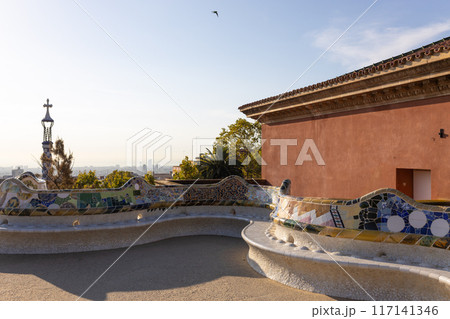 Serpent bench made of mosaic tiles in Park Guell in Barcelona. UNESCO World Heritage Site. Concept of travel, tourism and vacation 117141346