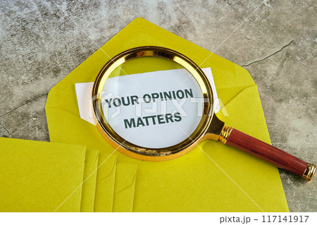 The words YOUR FEEDBACK MATTERS through a magnifying glass on a piece of mustard-colored envelope The words YOUR FEEDBACK MATTERS through a magnifying glass on a piece of mustard-colored envelope 117141917