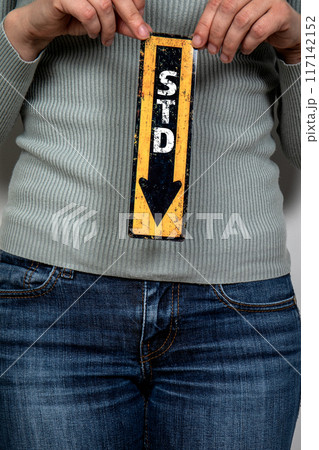 STD sexually transmitted diseases. Pointing arrow with text. Women's health and wellness concept 117142152