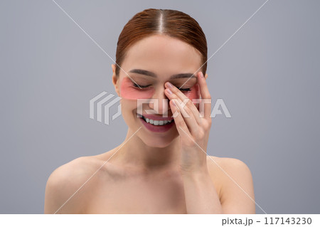Portrait of a pretty young woman with moisturizing patches under her eyes 117143230