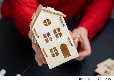 Master class of making craft wooden houses for conscientious Merry Christmas decor. Sustainable celebration minimal responsible DIY holiday project. Step by step instruction Festive modern 117144649