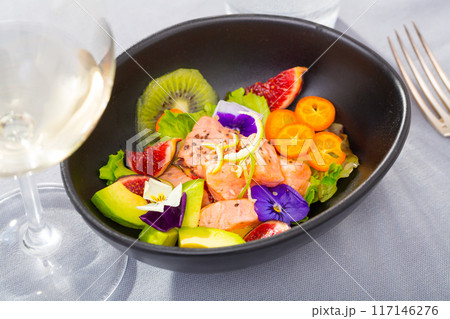 Ceviche of salmon with avocado, cumquat, kiwi fruit, figs 117146276