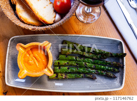 Asparagus dish with Romesco sauce 117146762