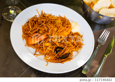Tasty noodles with prawns and mussels with sauce 117146882