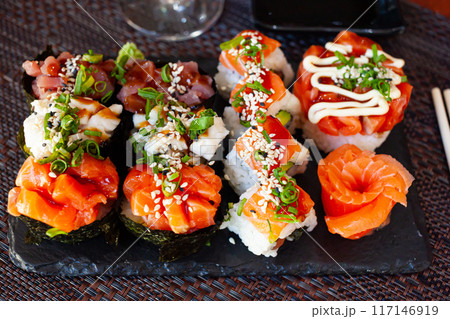 Set of different sushi - gunkan, uramaki and sashimi. Japanese cuisine 117146919