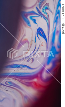 Foam fluid spill. Paint flow. Defocused purple blue pink color acrylic emulsion bubbles wave on dark abstract art background. Foam fluid spill. Paint flow. Defocused purple blue pink color acrylic emulsion bubbles wave on dark abstract art background. 117148021