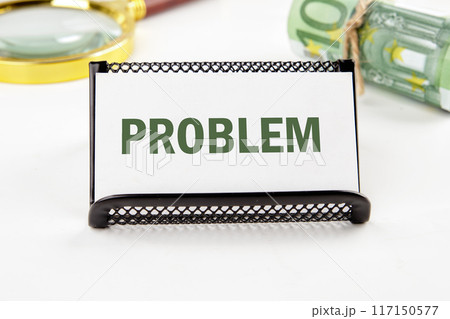 PROBLEM text on a business card in a composition with Euro banknotes and a magnifying glass out of focus PROBLEM text on a business card in a composition with Euro banknotes and a magnifying glass out of focus 117150577