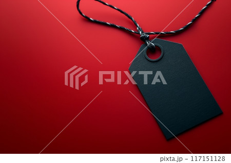 Minimalistic black tag on a vivid red background, featuring a sharp, modern design 117151128