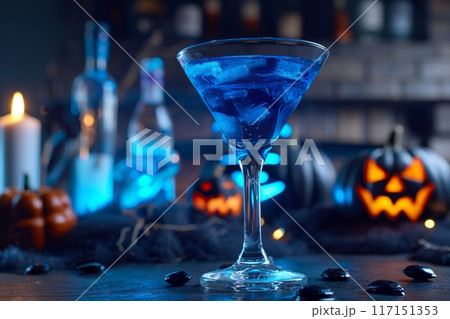 Striking blue martini illuminated by Halloween ambiance, perfect for eerie night celebrations 117151353