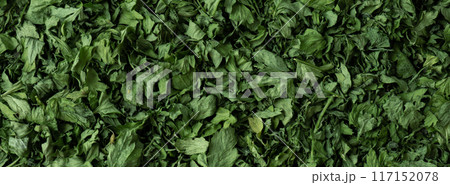 Dry parsley spice background. Homegrown herbs and spices for cooking backdrop. Fresh dried aromatic natural food ingredients 117152078