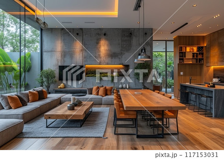 Modern living room with a large wooden dining table and chairs. Well lit and has a warm, inviting atmosphere Modern living room with a large wooden dining table and chairs. Well lit and has a warm, inviting atmosphere 117153031