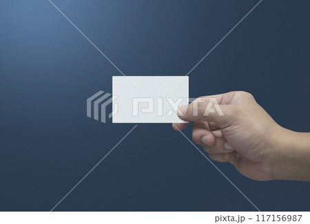 Man hand holding blank white business name card in fingers 117156987