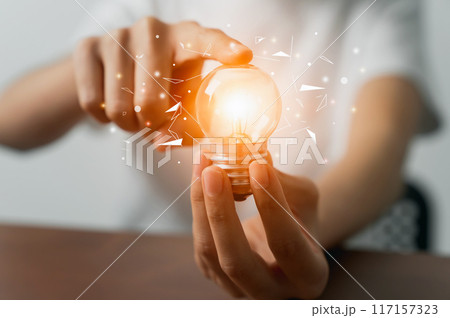 New idea and inspiration with brain concept, Hand holding light bulb. New idea and inspiration with brain concept, Hand holding light bulb. 117157323