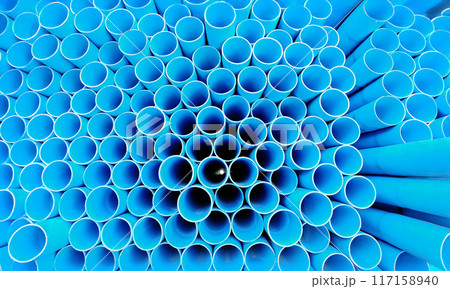 PVC pipes for Construction stacked on Shelf In Warehouse 117158940