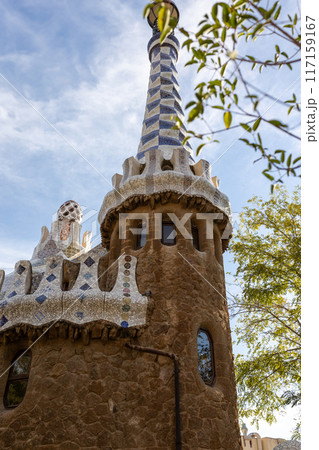 Fairytale gingerbread house in Park Guell designed by Antoni Gaudi in Barcelona, Spain. Sunny summer day in city 117159167