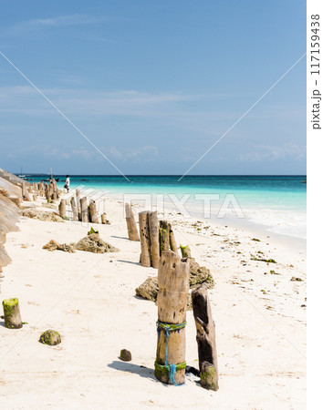beautiful view of blue ocean and sky from sandy beach 117159438