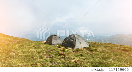 Tourist tents in camp in the mountain 117159666