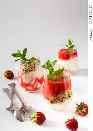 Granola and yogurt and strawberry smoothie Granola and yogurt and strawberry smoothie 117162119