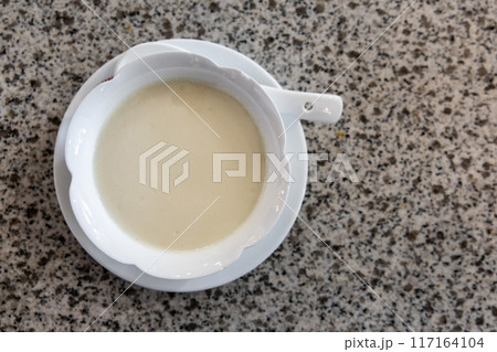Overhead view of steamed milk pudding curd dessert, popular sweet dessert especially among ethnic Chinese 117164104