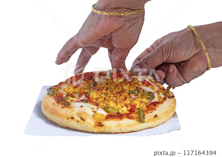 Woman's hand taking a pizza isolated on white background. Woman's hand taking a pizza isolated on white background. 117164394