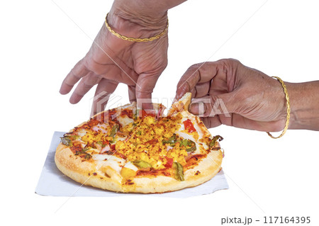 Hands taking a slice of pizza isolated on a white background. 117164395
