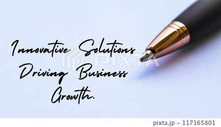 Innovative solutions driving business growth text with close up pen background. Business strategy and growth concept. 117165801