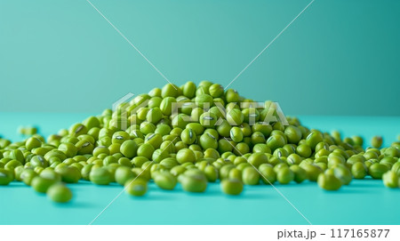 Featuring a few mung beans scattered from top to bottom on a clean light blue background. 117165877