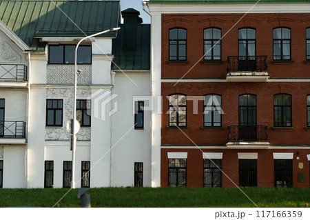 Two houses standing side by side in different styles of construction 117166359