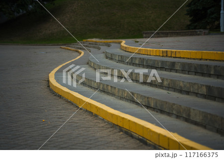 The steps in the park, the edges are painted yellow The steps in the park, the edges are painted yellow 117166375