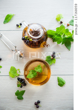 herbal tea from currant leaves and berries 117168059