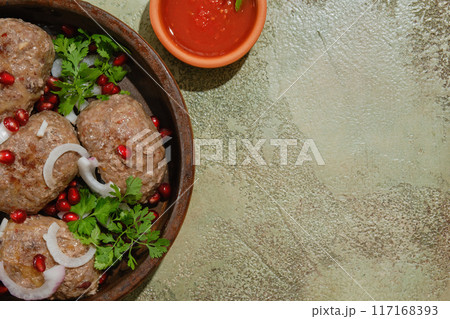 Georgian fried beef cutlets - Apkhazura in clay pot and adjika bowl Georgian fried beef cutlets - Apkhazura in clay pot and adjika bowl 117168393