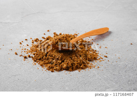 Traditional Georgian svanetian salt and wooden spoon on concrete background Traditional Georgian svanetian salt and wooden spoon on concrete background 117168407