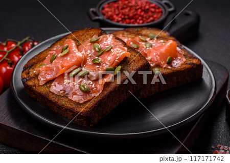 Sandwich or bruschetta with toast, salmon, cream cheese Sandwich or bruschetta with toast, salmon, cream cheese 117171742