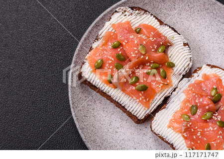 Sandwich or bruschetta with toast, salmon, cream cheese Sandwich or bruschetta with toast, salmon, cream cheese 117171747