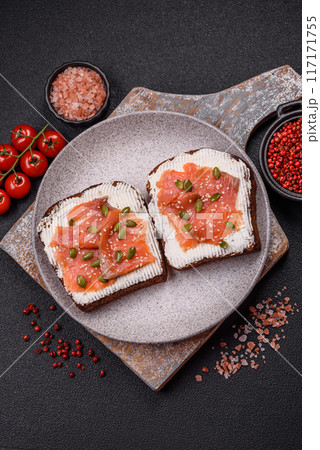 Sandwich or bruschetta with toast, salmon, cream cheese Sandwich or bruschetta with toast, salmon, cream cheese 117171755