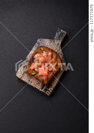 Sandwich or bruschetta with toast, salmon, cream cheese Sandwich or bruschetta with toast, salmon, cream cheese 117171978