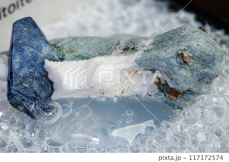 macro mineral stone Benitoite on a black background macro mineral stone Benitoite on a black background 117172574