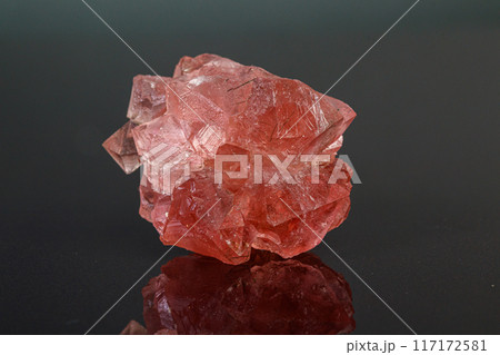 macro mineral stone pink fluorite on a black background 117172581