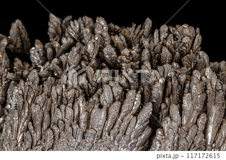 Macro of a stone Stibnite mineral on a black background 117172615