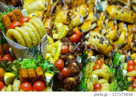 Appetizing colorful street fast food servings at a market stall, La Boqueria food market, Barcelona Appetizing colorful street fast food servings at a market stall, La Boqueria food market, Barcelona 117173038