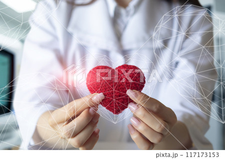 The doctor shows symbol of warmth and love for the patients. The doctor shows symbol of warmth and love for the patients. 117173153