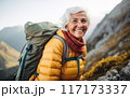Elderly woman smiling during a hike 117173337