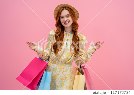 Contented young fashionista feeling good after shopping 117173784