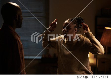 Furious woman with sharp knife in hand 117174151