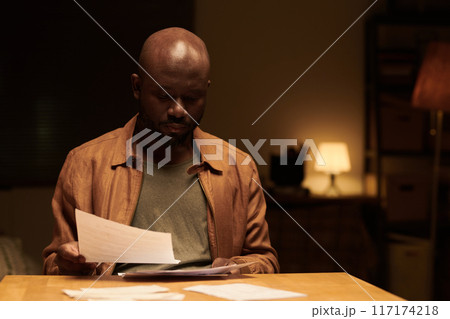 Looking through unpaid financial bills 117174218