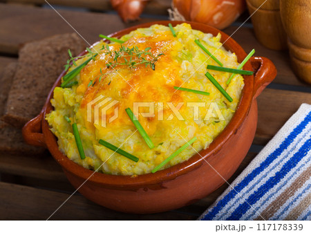 Clay pot of potato casserole Clay pot of potato casserole 117178339