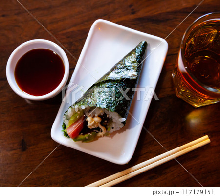 Temaki filled with rice, tuna and avocado 117179151