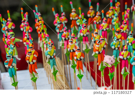 Little figurines made from dough at Chinese street vendor 117180327