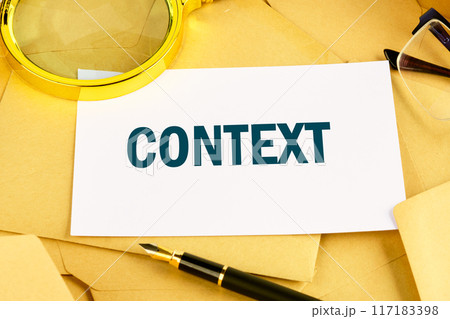 Content. Business and content and context concept. Text CONTEXT on a white business card lying on postal envelopes Content. Business and content and context concept. Text CONTEXT on a white business card lying on postal envelopes 117183398